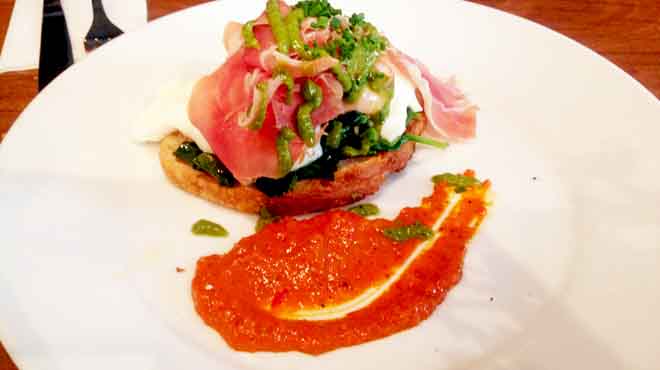 Mojo Eggs of Poached Eggs with Romesco, Prosciutto, Cavelo Nero, Mojo Verde & Sourdough